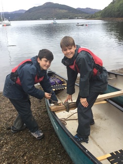 Image of two boys at rowing boat